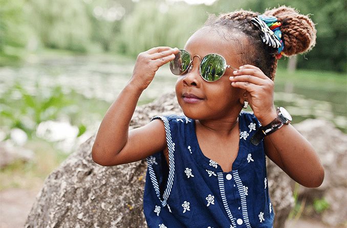 young child wearing sunglasses