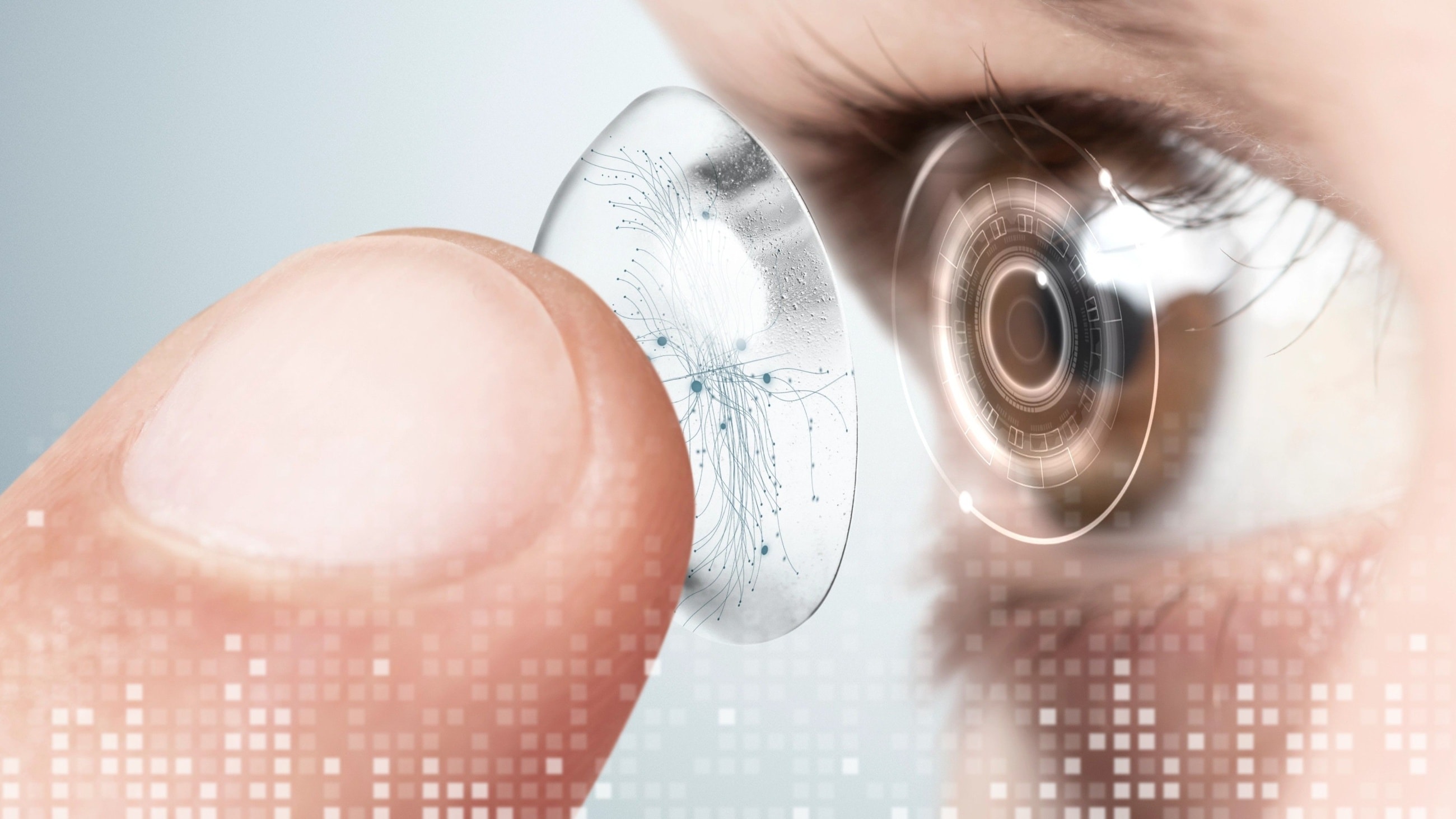 Woman putting a smart contact lense into her eye. Woman putting a smart contact lense into her eye.
