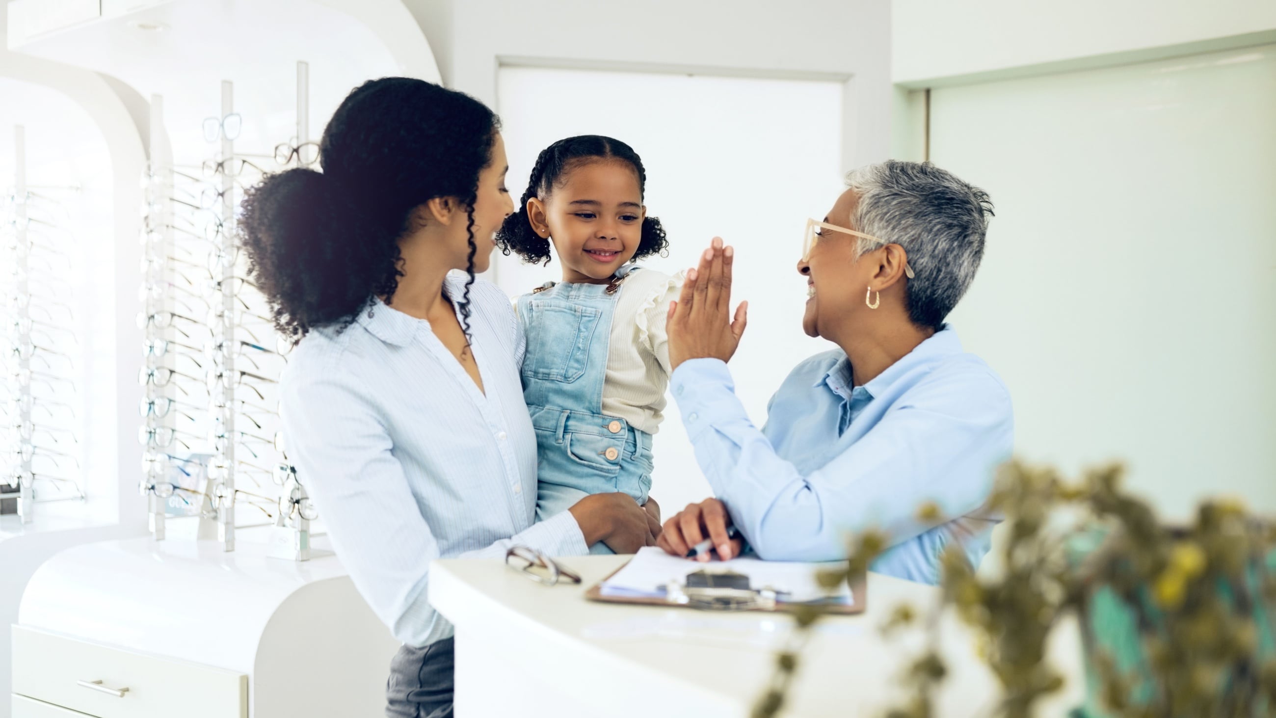 Woman and child meeting with eye provider Woman and child meeting with eye provider