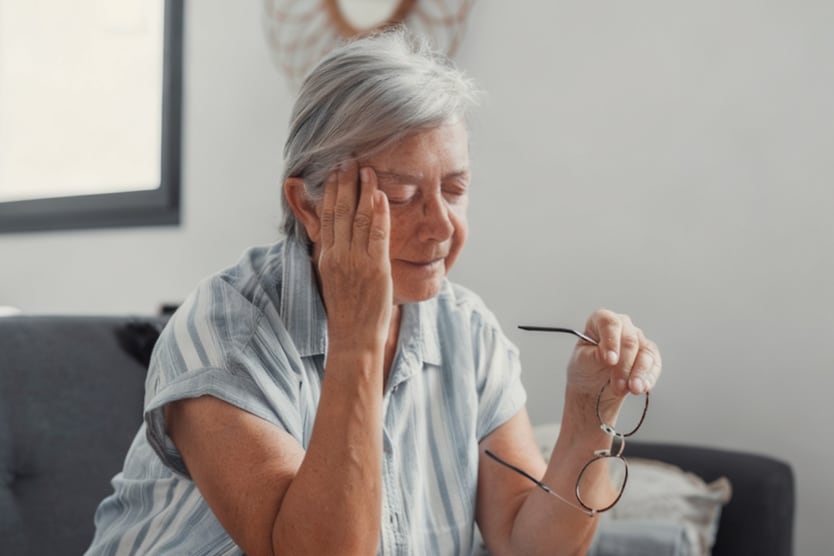 Woman with sudden vision loss sitting on the couch