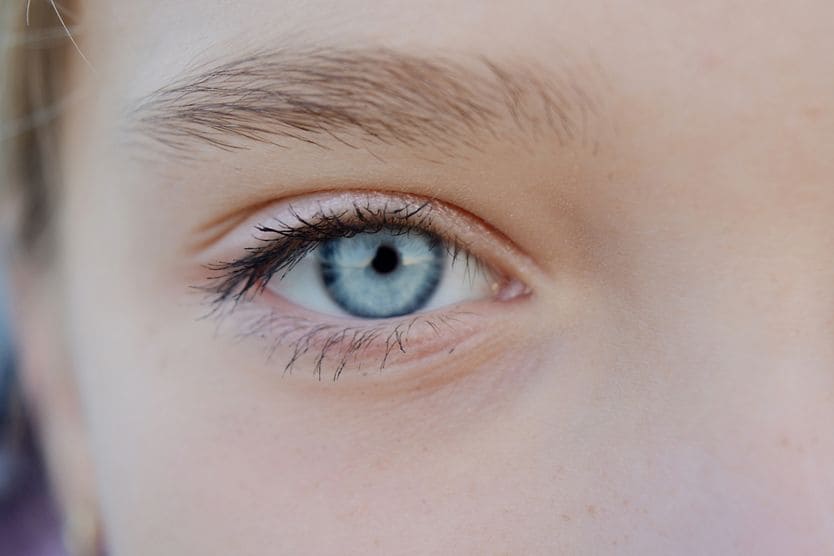 What do small pupils mean and when should you see a doctor? closeup of young child's small pupils