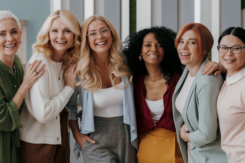 group of women of all ages laughing and smiling