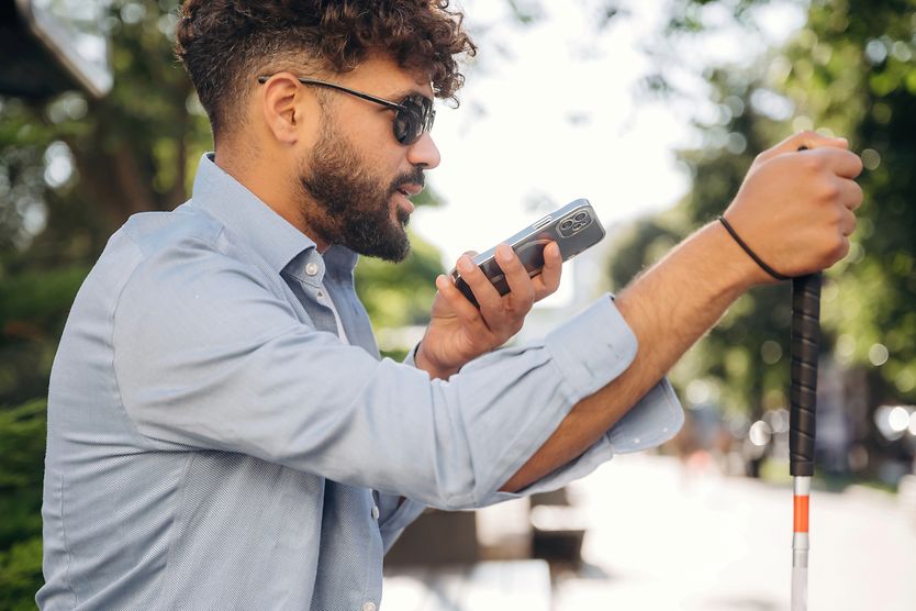 Visual impairment: What is impaired vision? man who is legally blind on his phone