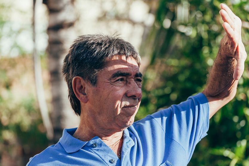 Solar retinopathy: Retina burn from sunlight Man shielding his eyes from the sun