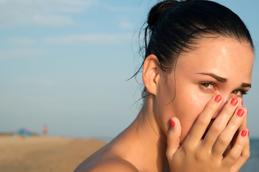 woman with ocular syphilis on the beach