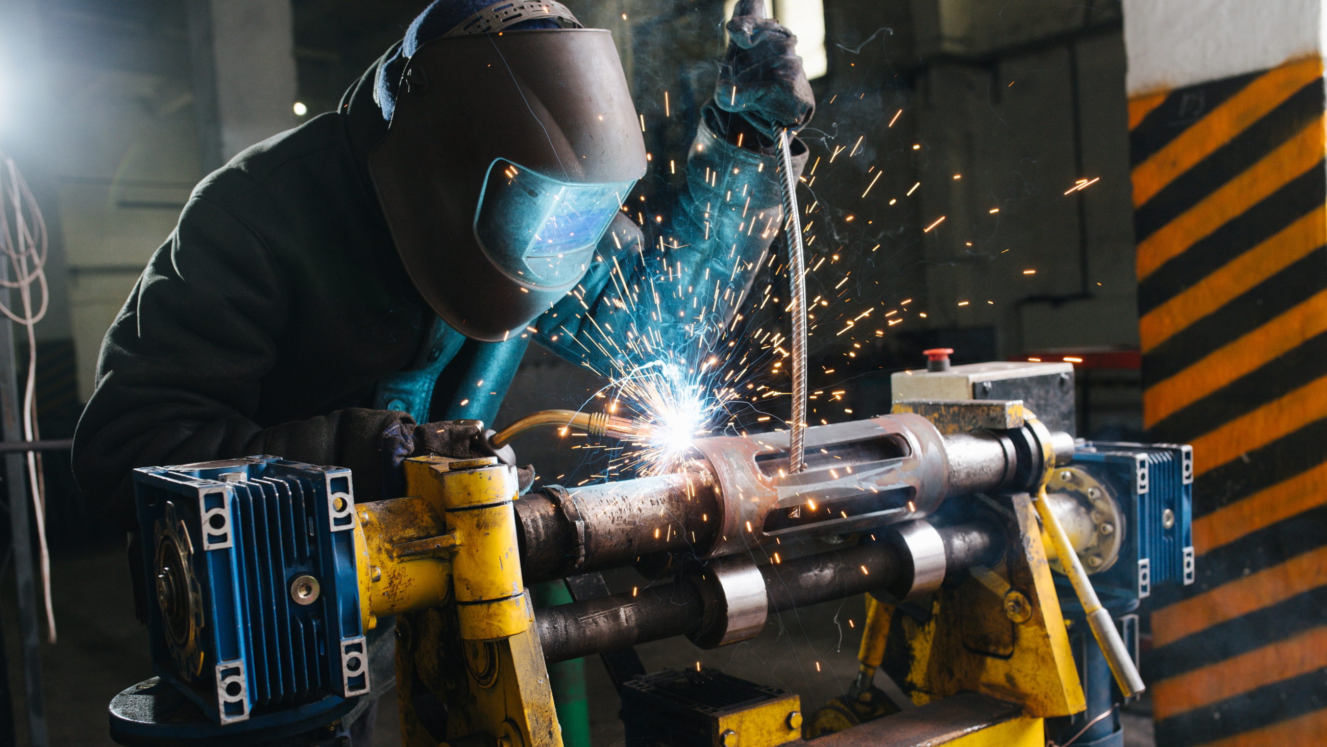 Welder wearing face and eye protection