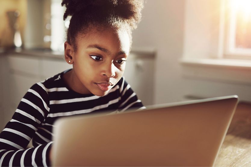 girl staring at computer screen