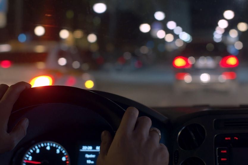 person with night myopia driving at night