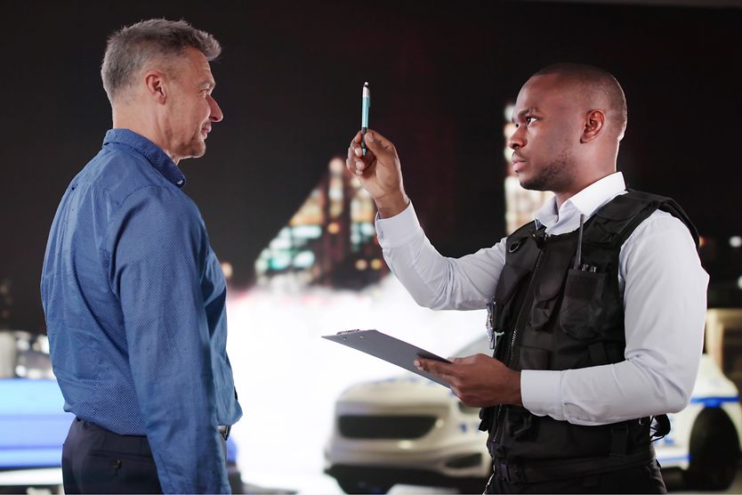 Police officer conducting a field sobriety test