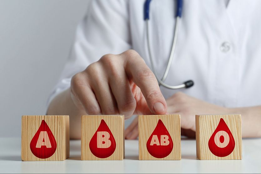 doctor pointing to blocks with blood types