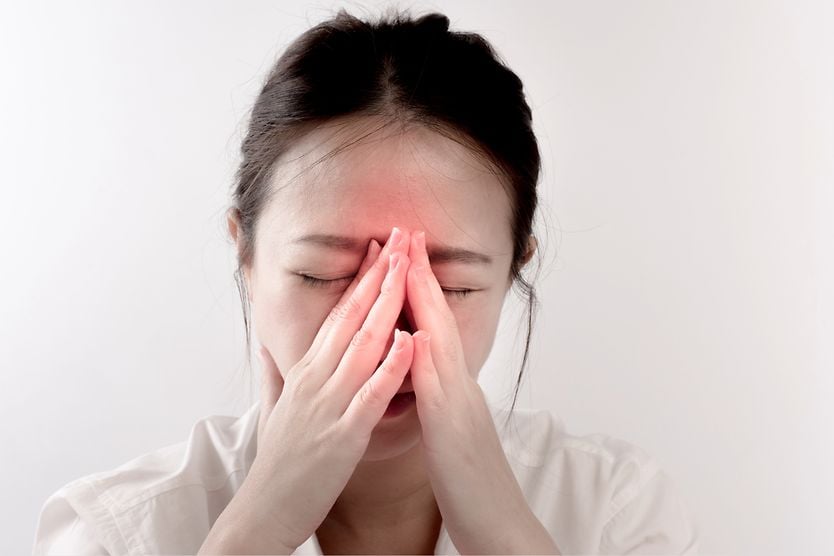 How sinuses affect the eyes, and what you can do about it woman with sinusitis affecting her eyes