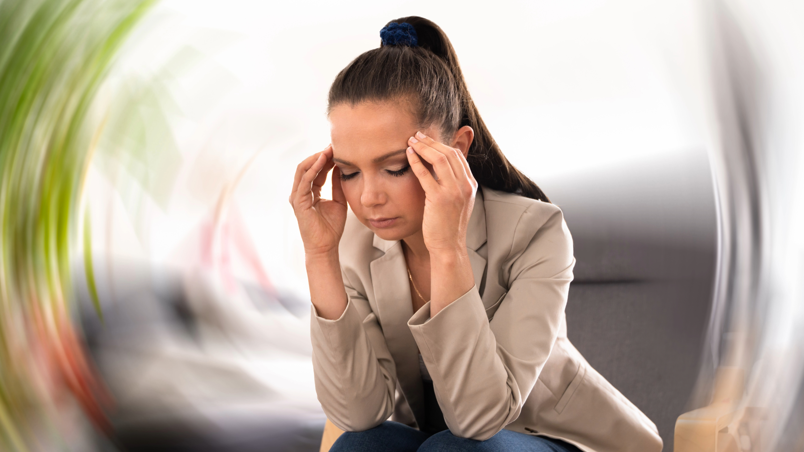 Person experiencing an episode of vertigo where the room appears to be spinning around her.
