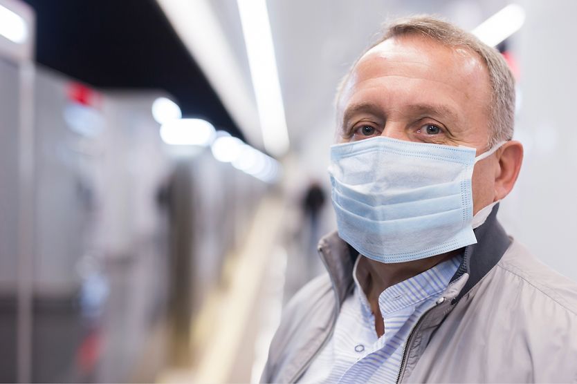 COVID-19 precautions and eye health awareness Person wearing a face mask in public, reflecting eye health and safety concerns during the COVID-19 pandemic.