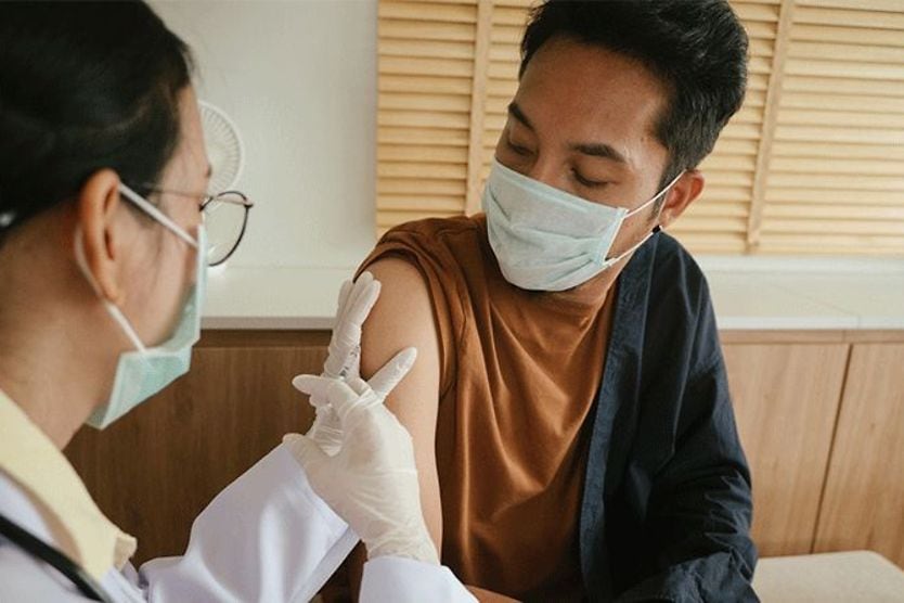 The COVID-19 vaccine: Will it affect your vision? man getting the covid-19 vaccine shot