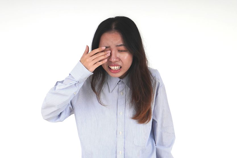 Why does it feel like something is in my eye? woman with something in her eye