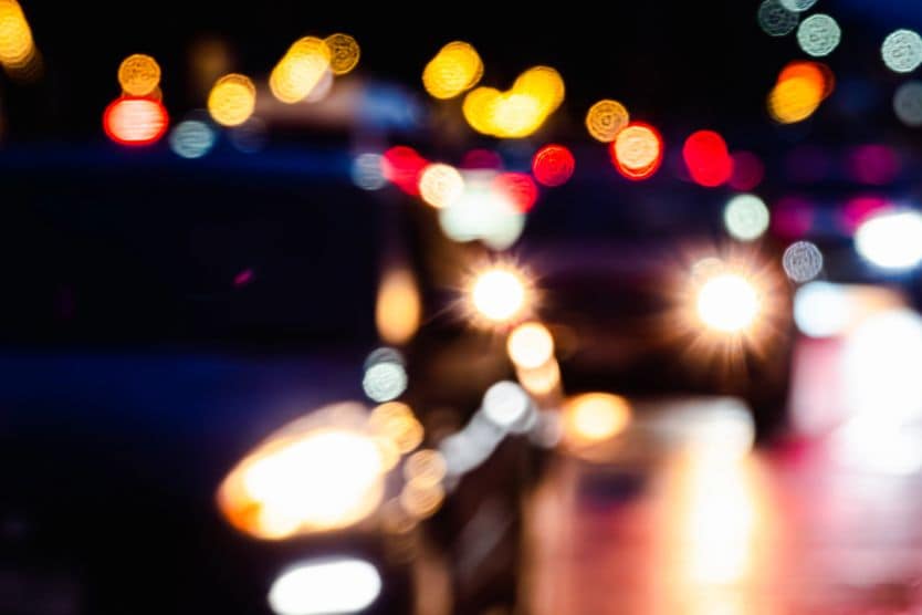 What causes halos around lights? man driving at night seeing halos around lights