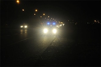 Why do I see a star-shaped glare around lights?