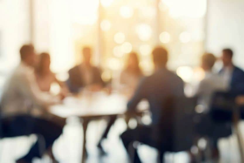 cloudy image of a people at a table