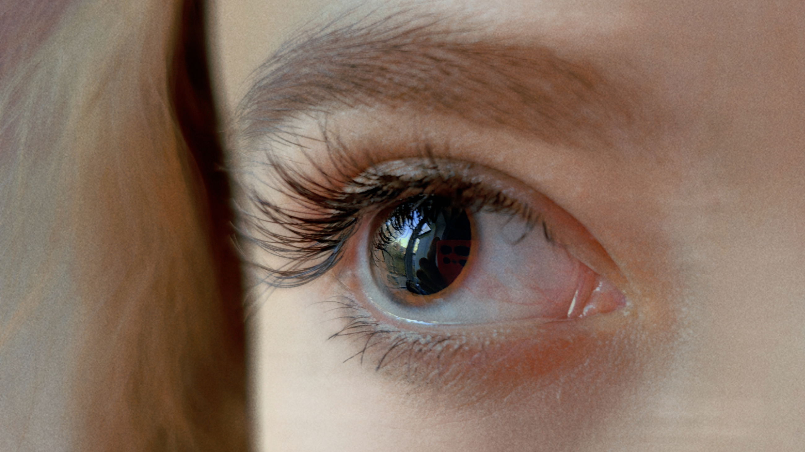 Woman with dilated pupils.