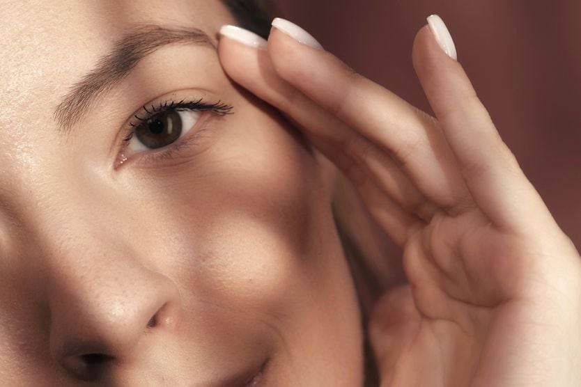 Eyebrow twitching: Causes and treatment woman with a twitching eyebrow