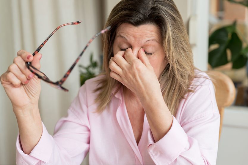 Myokymia: Eyelid twitch or tic woman tired pinching eyes