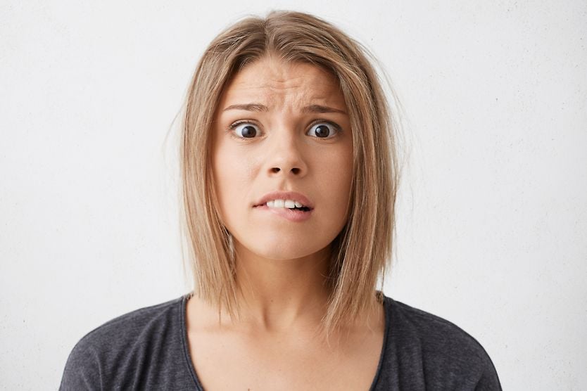 When should you worry about an eye twitch? woman worried about her eye twitching
