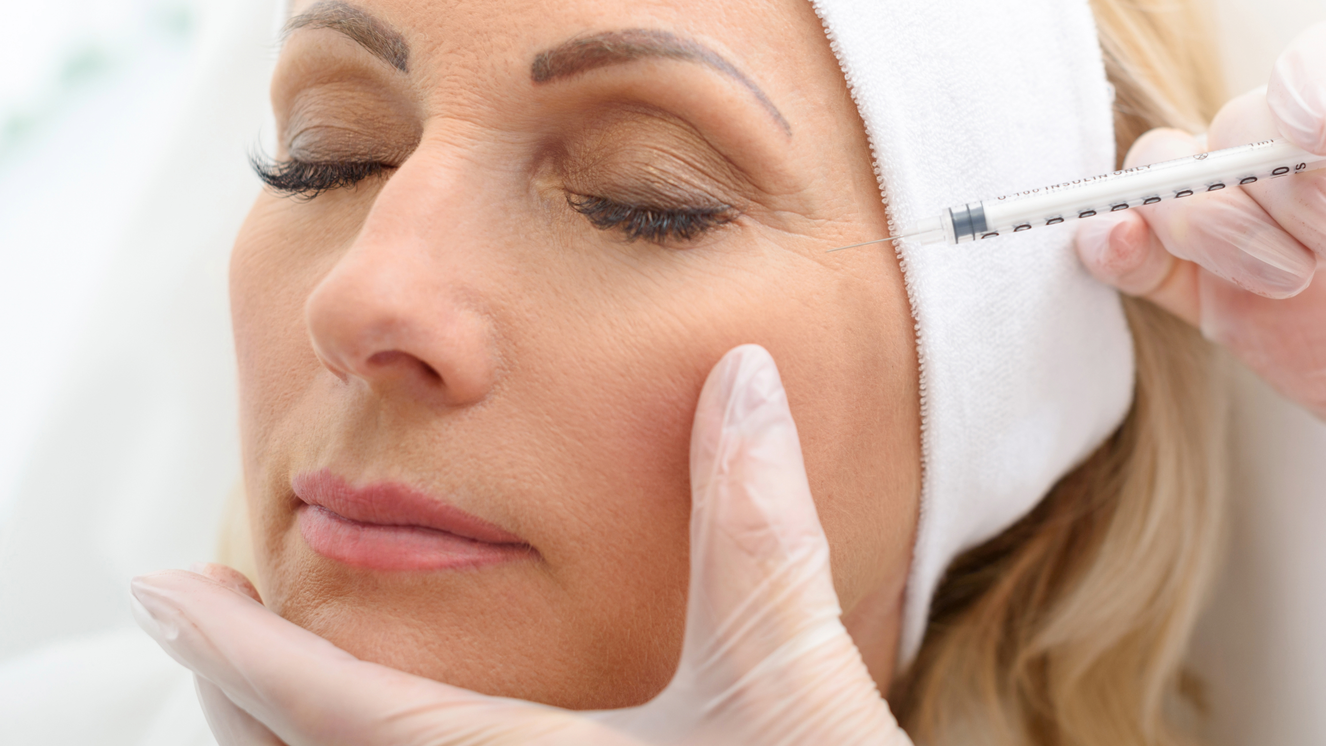 woman receiving botulinum toxin injection