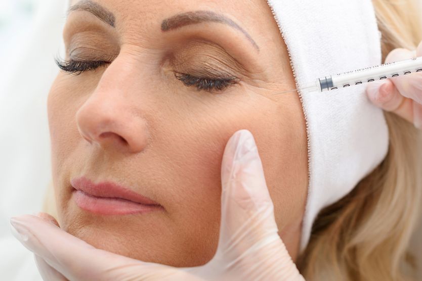 Botulinum toxin and side effects woman receiving botulinum toxin injection