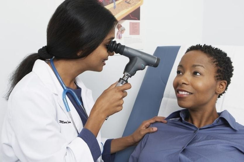 What is an ophthalmologist? An ophthalmologist uses a small device to view her patient's eyes more closely.