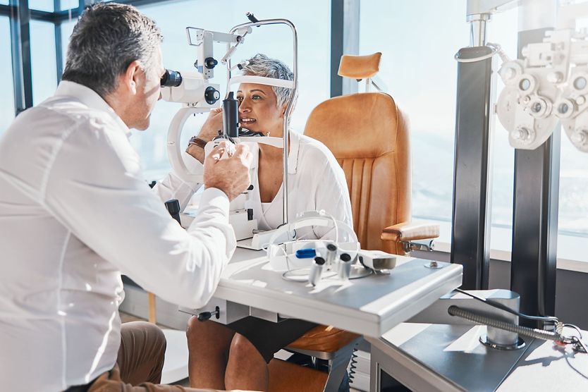 Optometry Mature woman consulting for eyesight at optometrist.