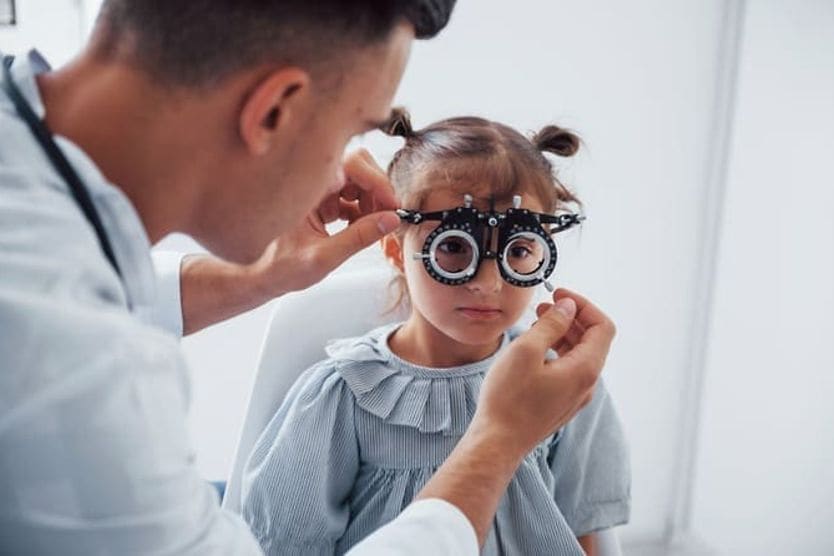 What is a pediatric ophthalmologist? A little girl has her vision assessed by her pediatric ophthalmologist.