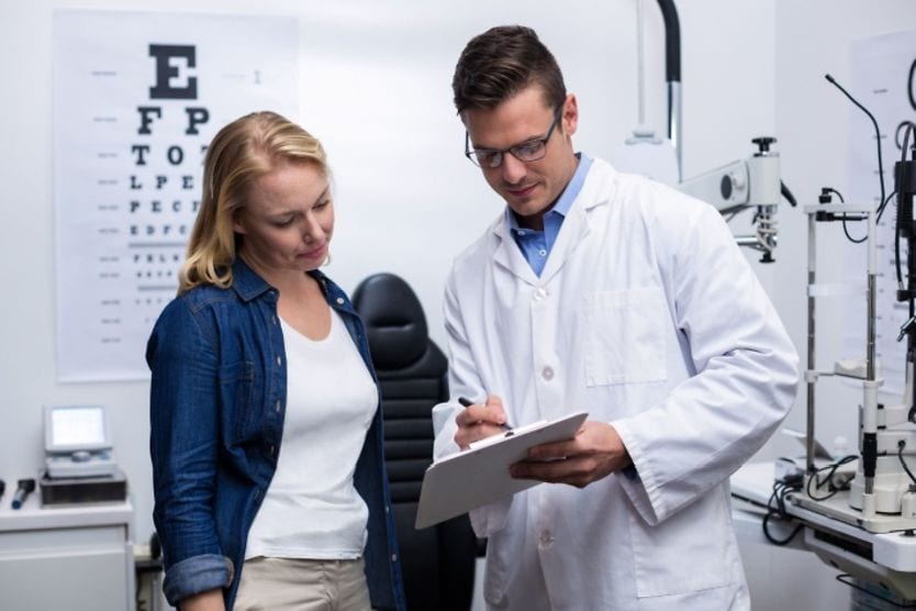 Patient with eye doctor. Patient with eye doctor.