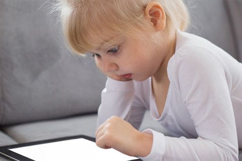 How screens affect kids’ eyes and what you can do about it Child using computer tablet