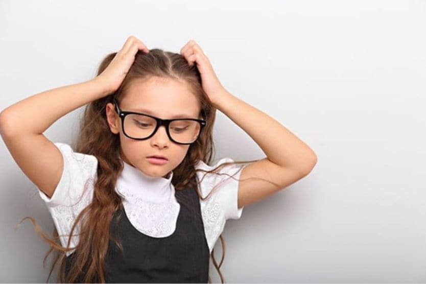 Child with headache from glasses