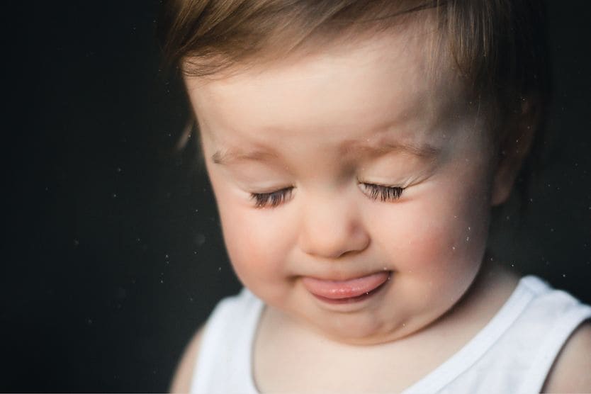 How to detect eye problems in toddlers toddler closing eyes and sticking out tongue