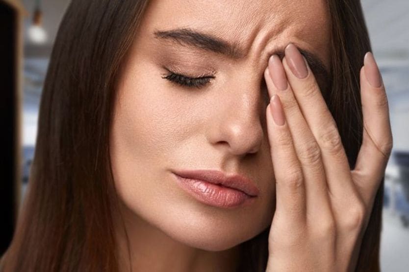 7 everyday things that can hurt your eyes woman with eye irritation