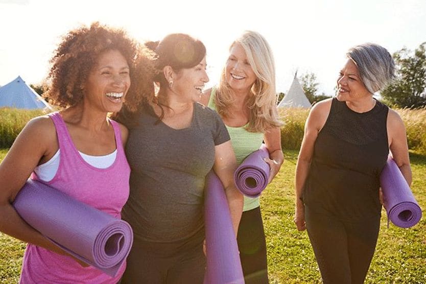 How can exercise improve cognitive performance? group of older woman with yoga mats