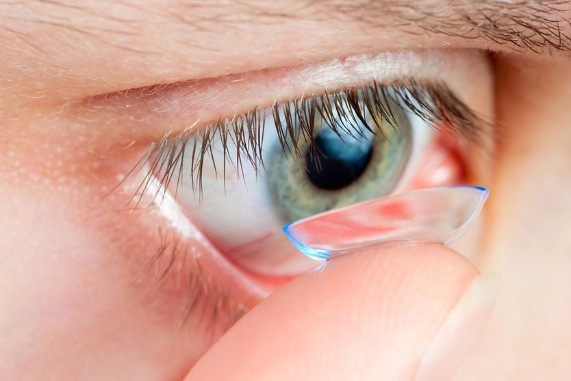 Scleral GP contact lenses: How these can help you person applying a contact lens
