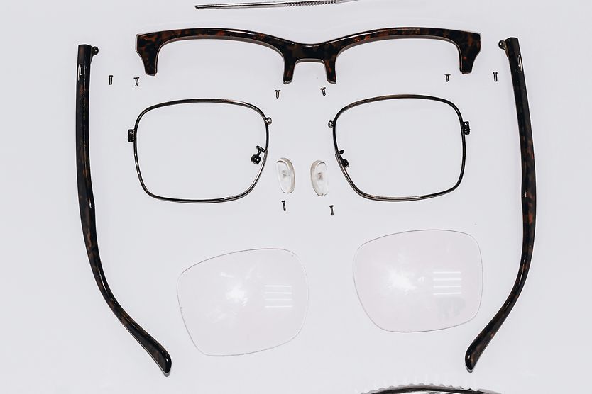 Eyeglass frame disassembled for parts.