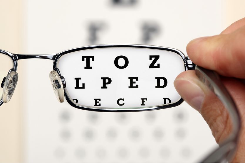 Why is there an expiration date on my eyeglass lens prescription? man peering through expired lens in eyeglasses