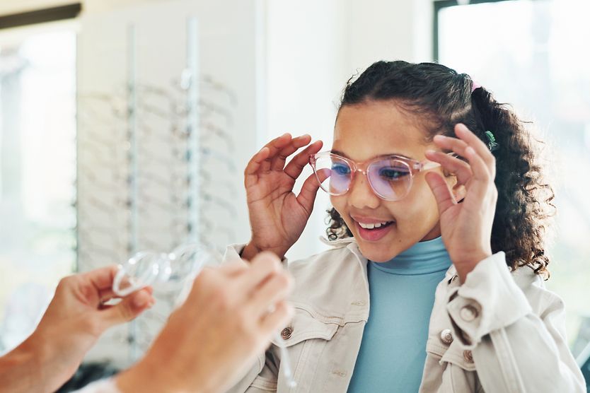 girl in glasses shop