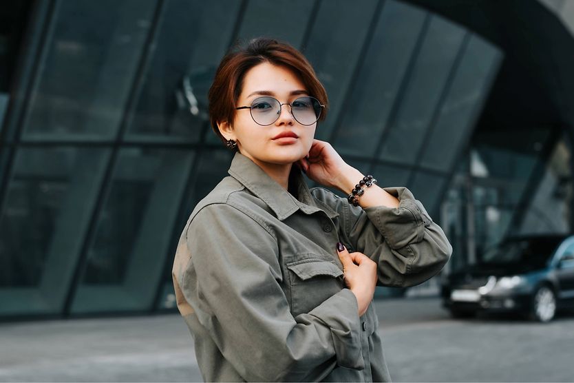 Glasses for round faces Woman with round shaped glasses.