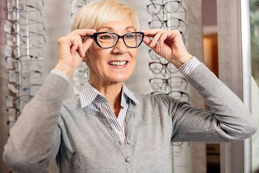 Best glasses for small faces Mature woman trying on eyeglasses