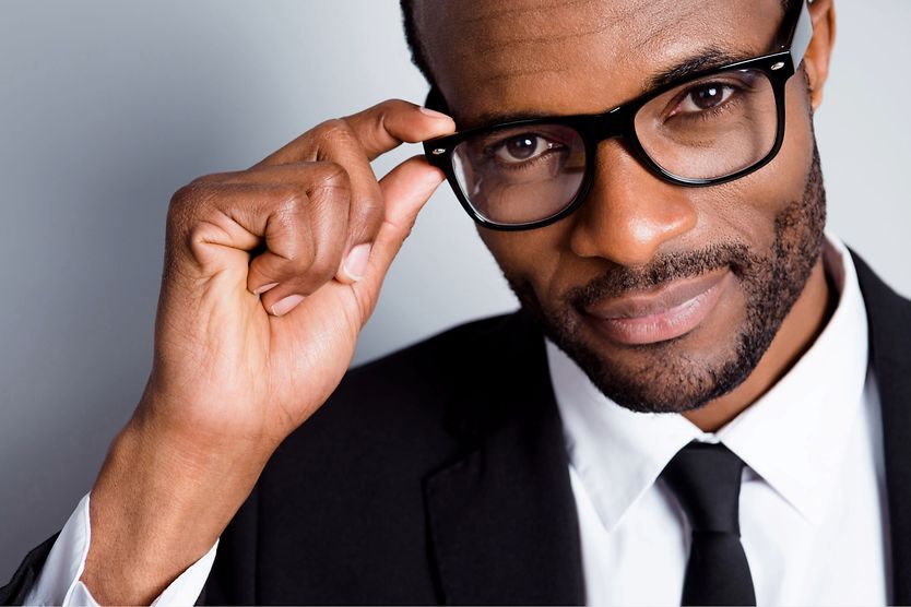 A helpful guide to men’s glasses man in suit wearing glasses
