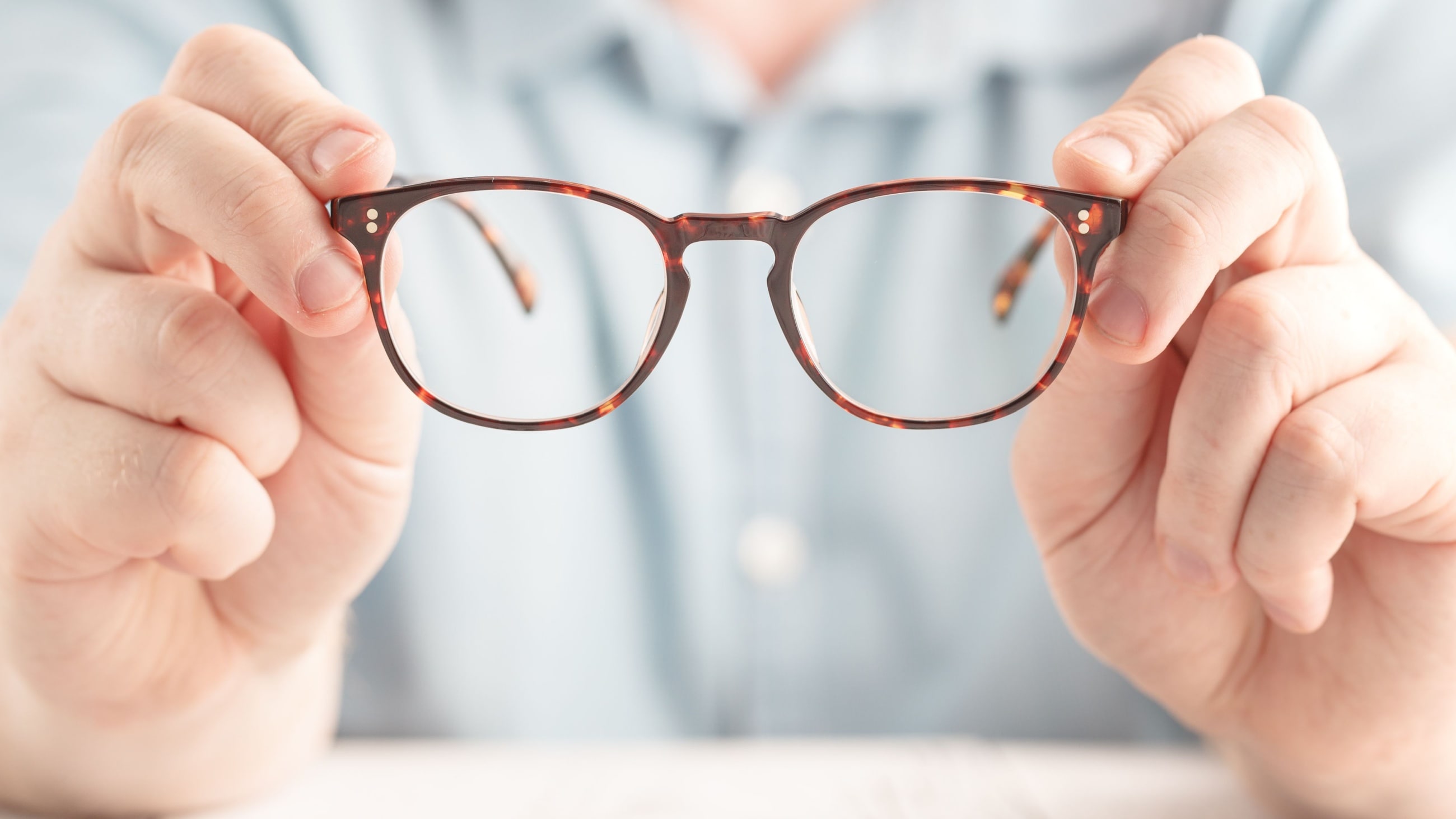 putting eyeglasses on