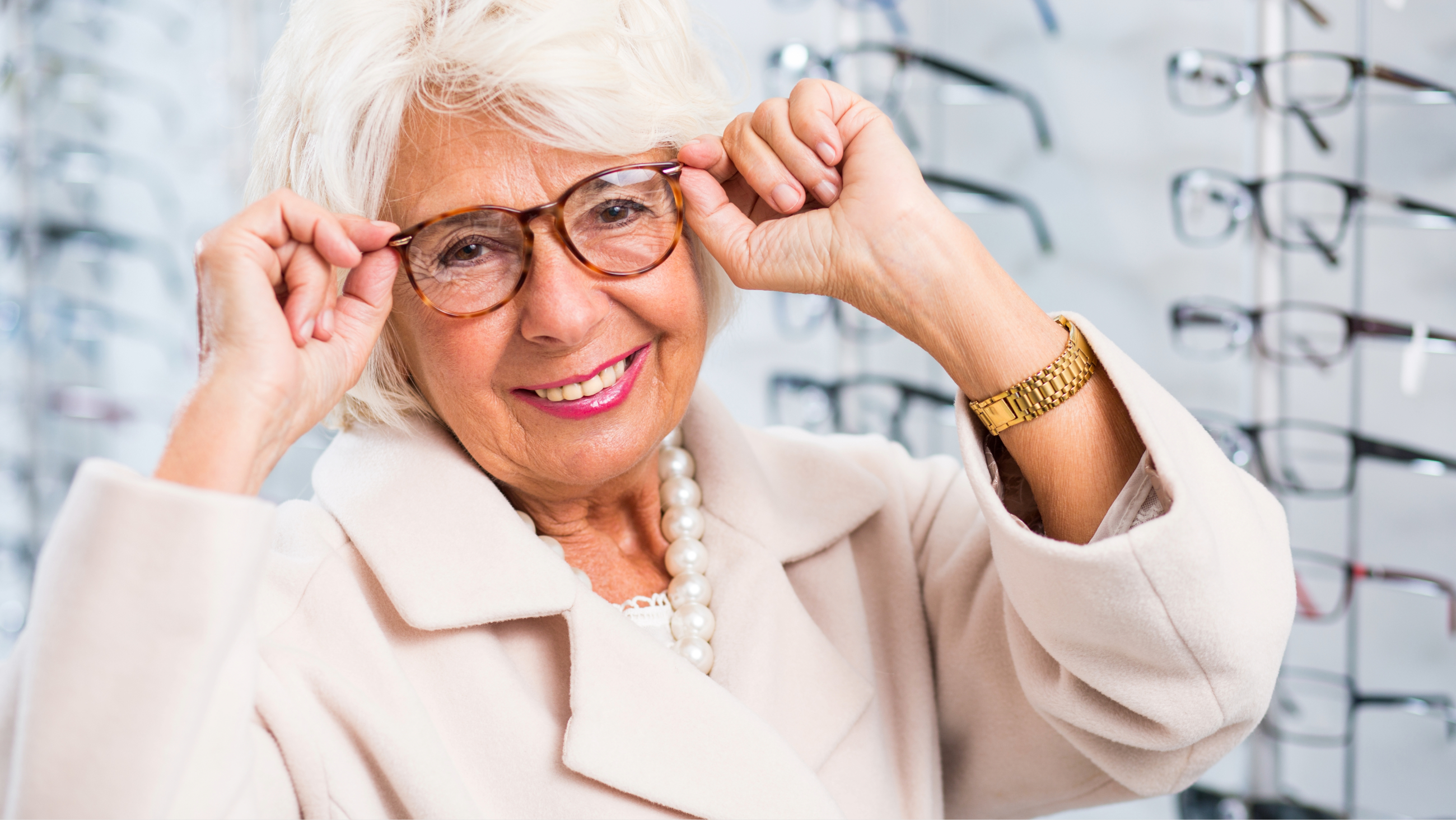 older woman trying on reading glasses and multifocals