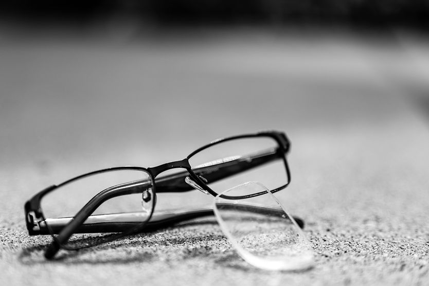 How to pop lenses back into glasses Pair of glasses with lens popped out.