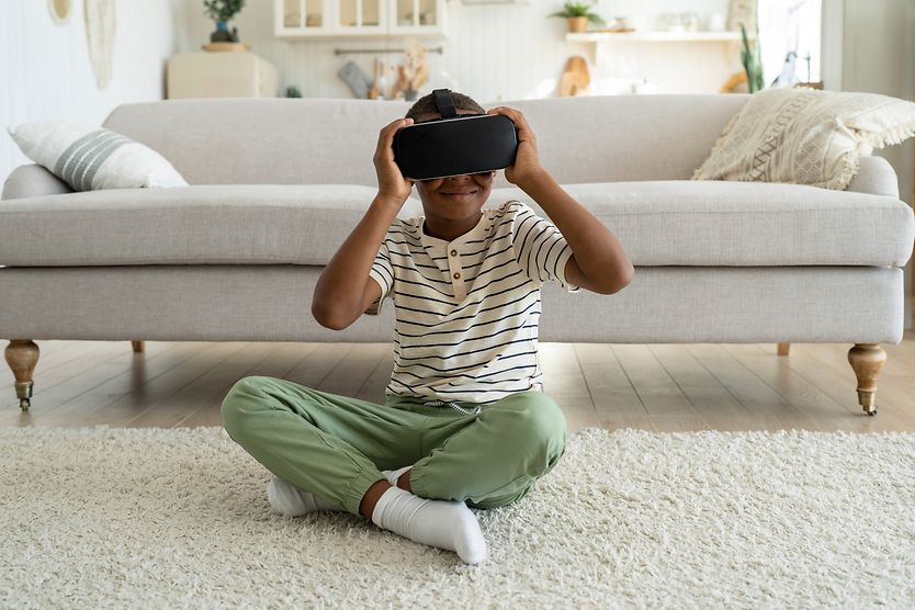 Can VR headsets harm your eyes? young girl wearing vr headset