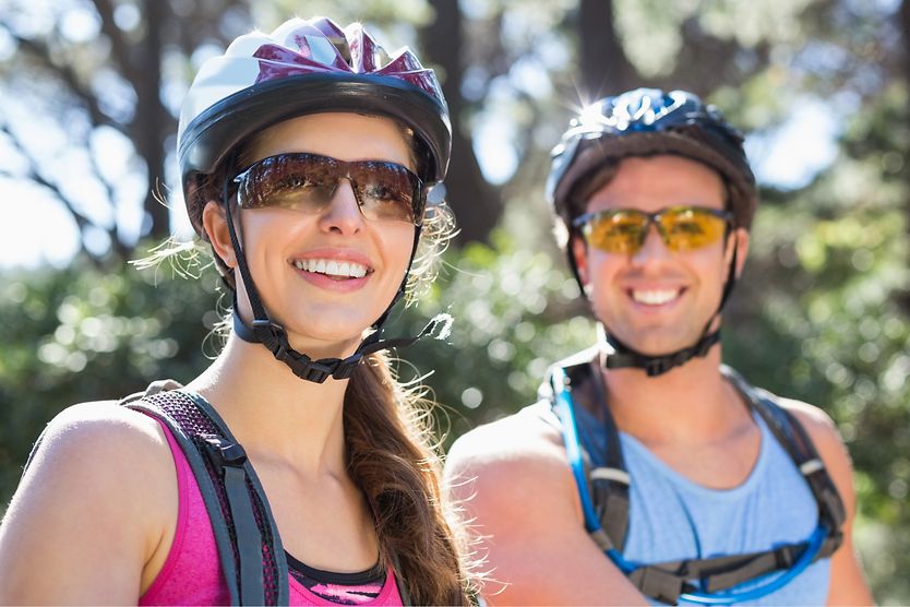 Wraparound sunglasses: When are they the best fit? Male and female cyclists wearing wraparound sunglasses