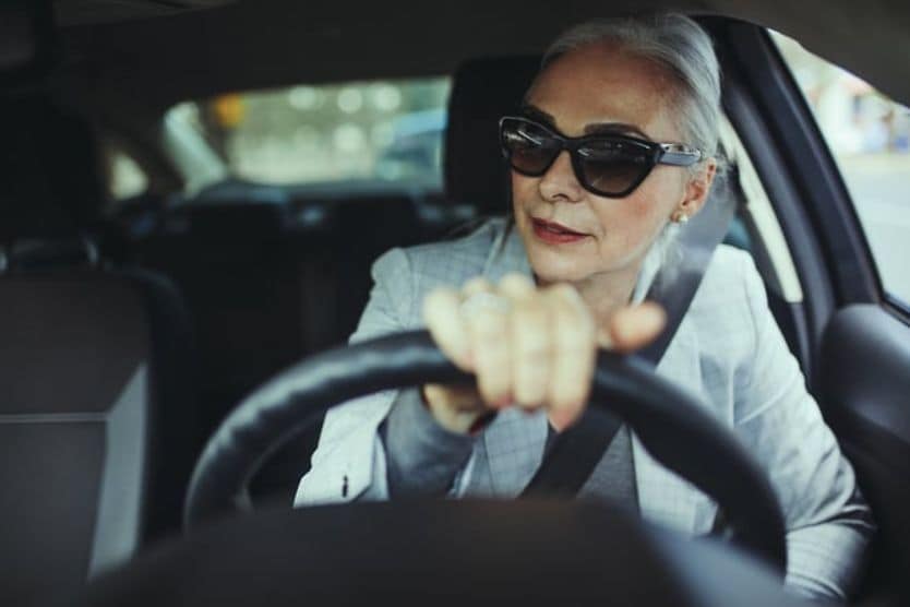 woman in sunglasses driving